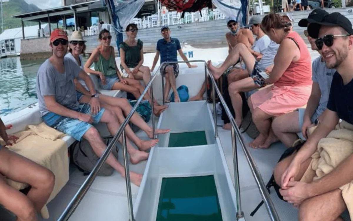 Passengers on the deck of a tour boat in the Seychelles