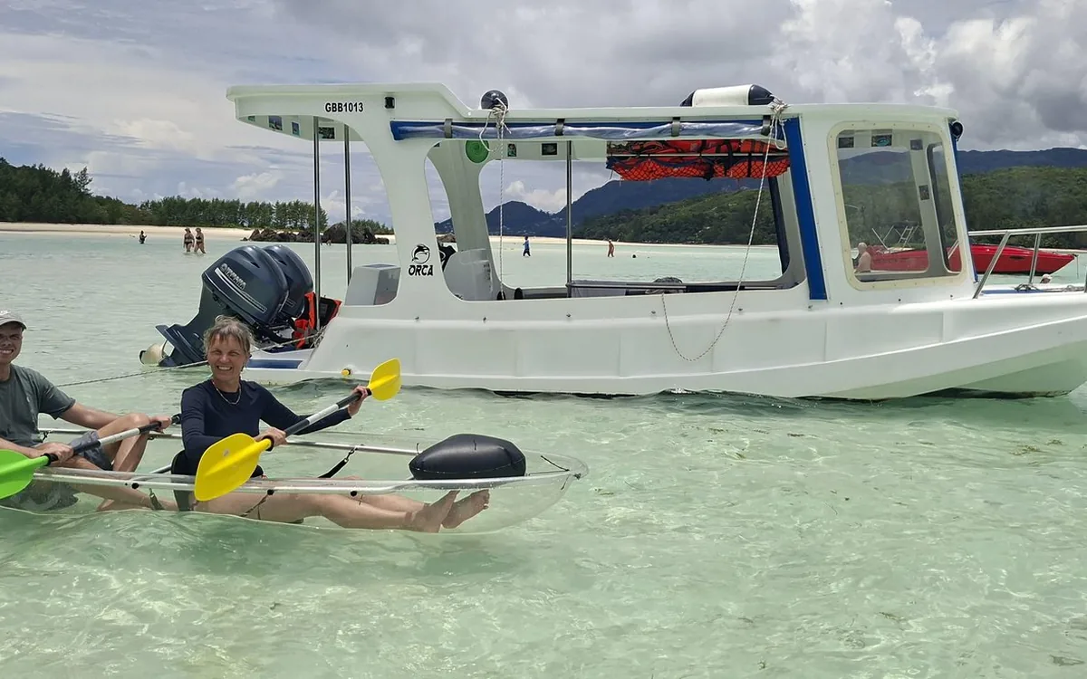 A glass-bottom boat in the Sainte Anne Marine National Park